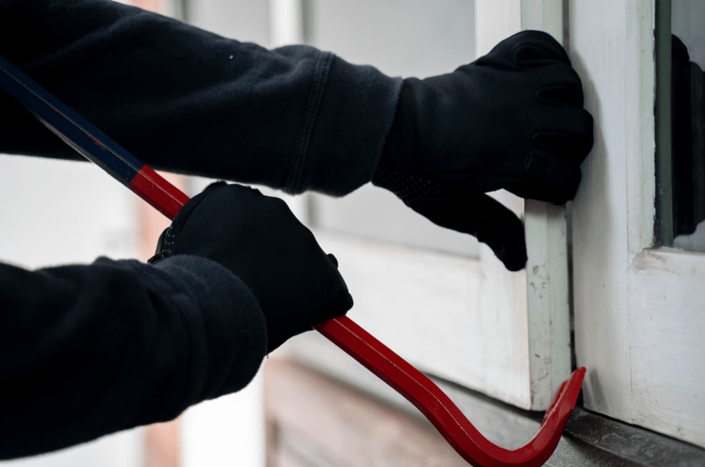 Burglar by a window